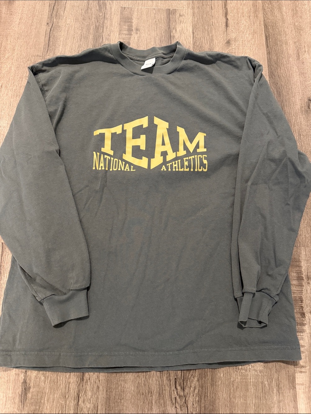 TNA Long Sleeve Tee in green with yellow TEAM Graphic